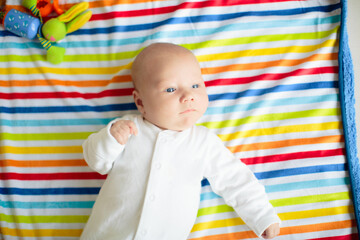 Wall Mural - little baby on rainbow blanket