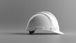© Coosh448 - A sleek white hard hat is displayed from a side perspective on a simple gray background, perfect for construction or industrial-themed stock photography