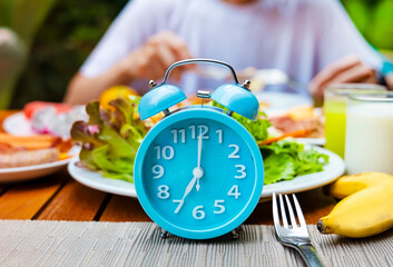 Wall Mural - Alarm clock with IF (Intermittent Fasting) 16 and 8 diet rule and weight loss concept.-Diet plan concept