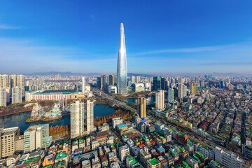 Wall Mural - Songpa-gu, Seoul, South Korea - November 8, 2020: Aerial view of houses and highrise apartments with Lotte World Tower and Lotte World near Seokchon Lake in autumn