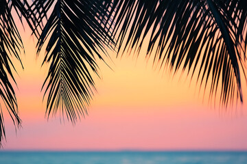 Wall Mural - A serene sunset over the ocean, framed by palm leaves, creating a tranquil atmosphere.