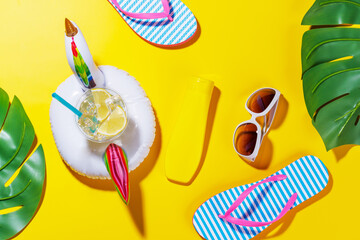 Poster - A vibrant summer vacation scene with flip flops, shades, and a floating flamingo