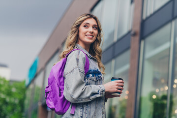 Canvas Print - Profile photo of nice young woman backpack coffee look away think wear denim jacket walk city center outdoors