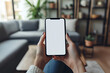 © Nadezda Ledyaeva - Woman hand holding using touch mobile phone white screen mockup Back view
