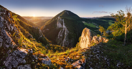 Wall Mural - Mountain sunset landscape at sunset with sun and rock valley, Slovakia, Maninska Tiesnava