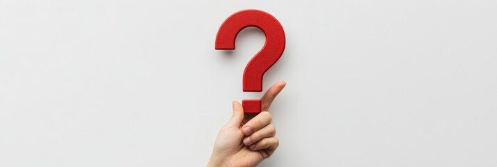 Poster - Single hand holding a red question mark on a white background. Symbol of doubt, inquiry, and answers.