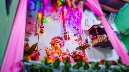 worshipping god Ganesha in ganesh chaturthi festival in india.