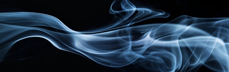 Swirling blue smoke on a black background creating a mystical atmosphere during a quiet night