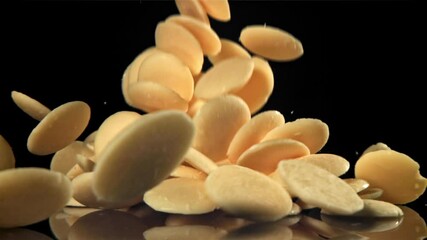 Sticker - White chocolate chips fly and fall. Filmed on a high-speed camera at 1000 fps. High quality FullHD footage