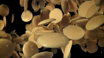 Canvas Print - White chocolate chips fly and fall. Filmed on a high-speed camera at 1000 fps. High quality FullHD footage