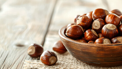 Canvas Print - Sweet fresh edible chestnuts on light wooden table, closeup