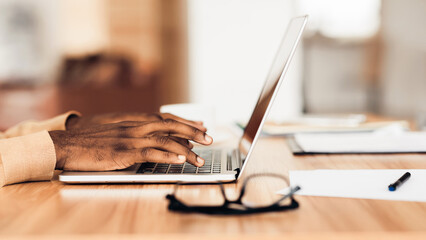 Poster - Information Searching. African american businessman using laptop, close-up of hands. Panorama, free space