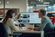 © DK_2020 - Salesperson and customer discussing financing options at a car dealership