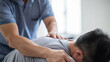 © NOPPHINAN - Therapist performing a shoulder massage on a patient