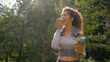 © Yuliia - Sport girl enjoy diet fruit nutrition at city outdoors park after workout training with water happy female diet fresh eat green apple vegetarian healthy lifestyle Caucasian woman fit food health care