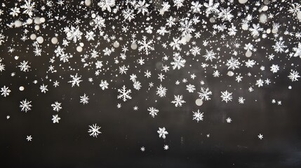 Canvas Print - White snowflakes falling against a dark background.