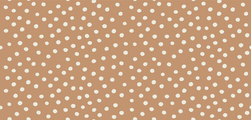 Wall Mural - hand drawn childish style vector pattern with ivory dots on a caramel brown background. polka dots p