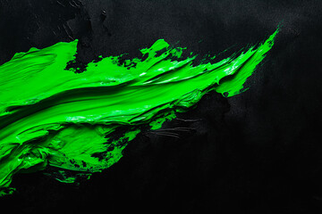 Wall Mural - bright green brush stroke of paint on black background