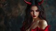 © Sanych - Portrait of a beautiful woman dressed as a sexy devil for halloween wearing red with devil horns