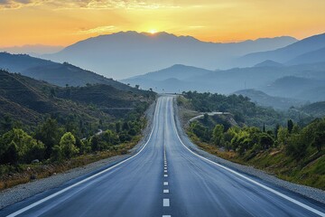 Empty asphalt road winding through beautiful green mountains at sunset