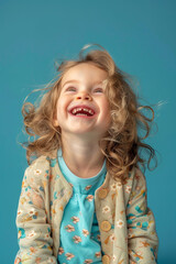 Playful child in trendy outfit enjoying a sunny day, smiling and laughing.