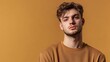 © Влада Яковенко - Photo portrait of pretty young male skeptical look empty space wear trendy brown outfit isolated on khaki color background