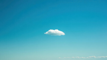 A vast, clear blue sky with a single white cloud drifting peacefully, offering a sense of serenity and openness.