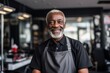 © Vorda Berge - Portrait of a middle aged black man hair salon owner