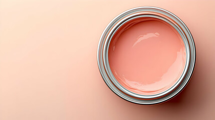 Wall Mural - A can of soft pink paint on a smooth surface, showcasing its glossy texture.