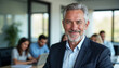 © abu - Middle-aged executive in a modern office, exuding confidence and leadership with a warm, inviting atmosphere.