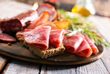 Canvas Print - Different Italian ham and salami with herbs