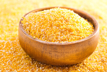 Wall Mural - corn porridge in wooden bowl