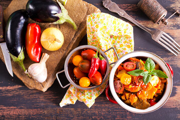 Wall Mural - potato stew cooked with peppers, tomatoes, and onions, in bowl