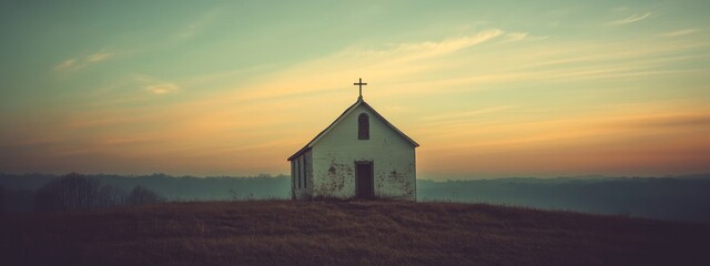 Wall Mural - Old chapel in the mountains at sunrise, panoramic image.