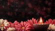 © Flowaiart - A candle is lit in front of a bunch of red and white flowers