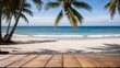 © ah.giel - Wooden table top with blurred tropical beach background.