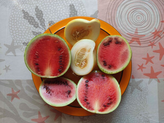 fresh fruit on a plate - melon and watermelon