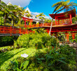 © Kotangens - Monte Palace tropical garden with red pagoda, lakes and traditional buildings above the city of Funchal, popular tourist destination in Madeira island, Portugal