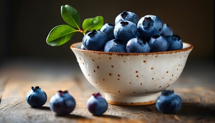 Wall Mural - Fresh blueberries beautifully arranged in a bowl