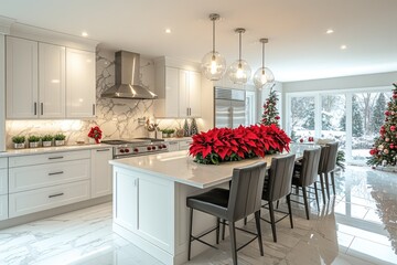 White modern kitchen interior, kitchen island decorated for Christmas holidays with ornaments and red Poinsettia flowers  