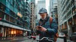 © Marco - middle aged man looking at his cell phone on a public road on his bicycle
