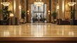 © Supriyanto - A blurred view of an elegant hotel lobby with a polished wooden table in the foreground.
