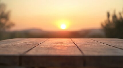 Wall Mural - A wooden table in the foreground with a beautiful sunset in the background.