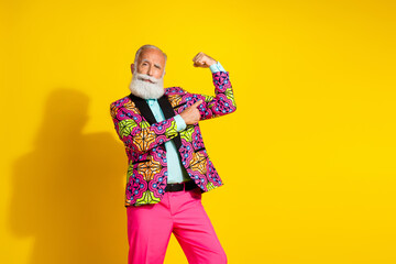 Sticker - Photo of handsome pensioner mister point flexing muscles dressed stylish colorful pink classy garment isolated on yellow color background