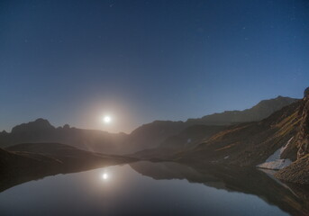 Wall Mural - soft focus. the moon shines over the night mountains. the moon is reflected in the lake.