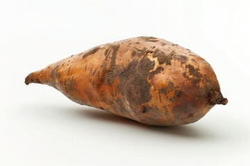 Poster - A close-up view of a sweet potato on a white surface, ideal for use in food and cooking related projects