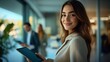 © willian - Confident Businesswoman Holding Tablet in Office