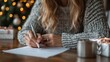 © Business Image - Cozy holiday writing: woman with ink pen crafting letter amidst festive christmas decor