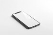 © Fotograf - A simple design of a black and white phone placed on a white surface