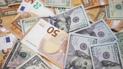 Poster - Euro and dollar banknotes chaotically spread across table symbolizing strong financial ties and trade relationships between European Union and United States